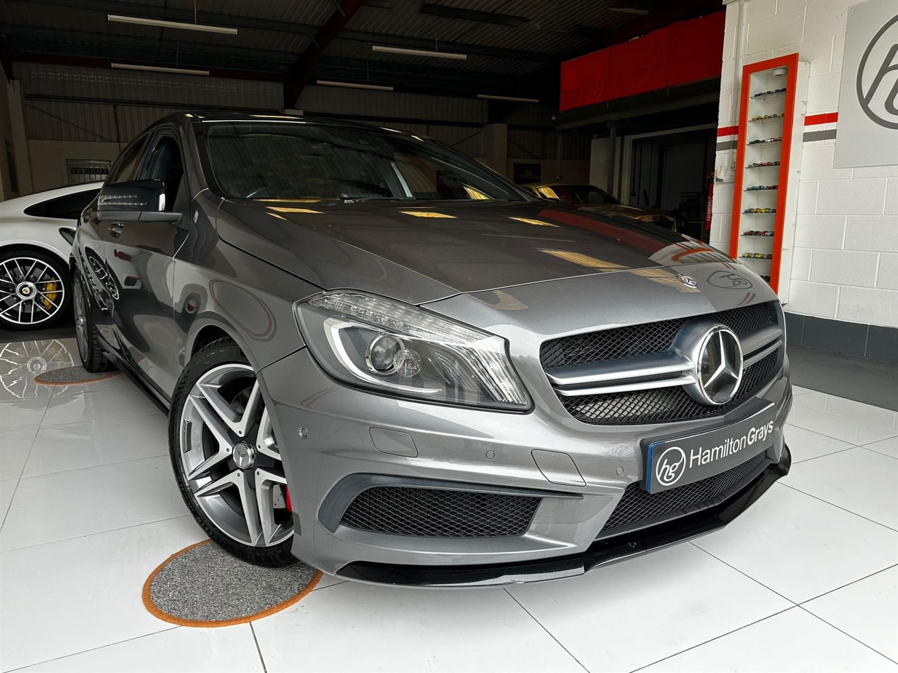 2014 (14) Mercedes-Benz A Class 2.0 A45 AMG SpdS DCT 4MATIC. In Mountain Grey Metallic / Black Artico Leather and Red Stitching.